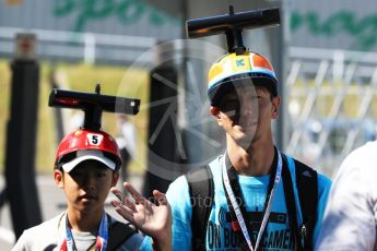 World © Octane Photographic Ltd. Formula 1 - Japanese Grand Prix - Sunday - Paddock.Japanese fans in camera hats. Suzuka Circuit, Suzuka, Japan. Sunday 8th October 2017. Digital Ref:1978LB1D9808