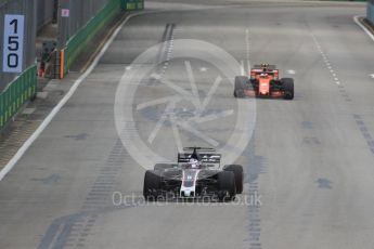 World © Octane Photographic Ltd. Formula 1 - Singapore Grand Prix - Practice 1. Romain Grosjean - Haas F1 Team VF-17 and Stoffel Vandoorne - McLaren Honda MCL32. Marina Bay Street Circuit, Singapore. Friday 15th September 2017. Digital Ref: 1958LB1D8669
