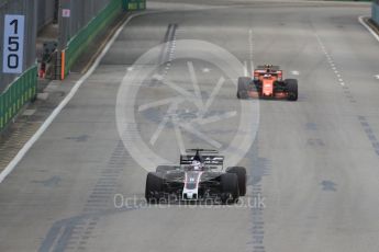 World © Octane Photographic Ltd. Formula 1 - Singapore Grand Prix - Practice 1. Romain Grosjean - Haas F1 Team VF-17 and Stoffel Vandoorne - McLaren Honda MCL32. Marina Bay Street Circuit, Singapore. Friday 15th September 2017. Digital Ref: 1958LB1D8669