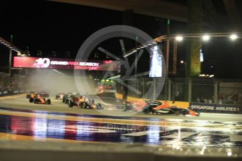 World © Octane Photographic Ltd. Formula 1 - Singapore Grand Prix - Race. The damaged Scuderia Ferrari SF70H makes contact with the Red Bull Racing RB13 of Max Verstappen who in turn hits the McLaren MCL32 of Fernando Alonso. Marina Bay Street Circuit, Singapore. Sunday 17th September 2017. Digital Ref: