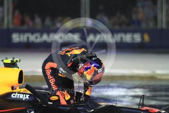 World © Octane Photographic Ltd. Formula 1 - Singapore Grand Prix - Race. Max Verstappen climbs out of his car at turn 1 lap 1 - Red Bull Racing RB13. Marina Bay Street Circuit, Singapore. Sunday 17th September 2017. Digital Ref: