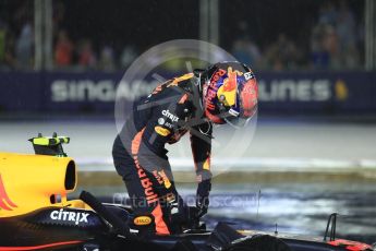 World © Octane Photographic Ltd. Formula 1 - Singapore Grand Prix - Race. Max Verstappen climbs out of his car at turn 1 lap 1 - Red Bull Racing RB13. Marina Bay Street Circuit, Singapore. Sunday 17th September 2017. Digital Ref: