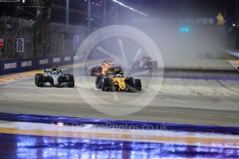 World © Octane Photographic Ltd. Formula 1 - Singapore Grand Prix - Race. Jolyon Palmer - Renault Sport F1 Team R.S.17 and Valtteri Bottas - Mercedes AMG Petronas F1 W08 EQ Energy+. . Marina Bay Street Circuit, Singapore. Sunday 17th September 2017. Digital Ref: