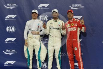 World © Octane Photographic Ltd. Formula 1 –  Abu Dhabi GP - Qualifying. Mercedes AMG Petronas Motorsport AMG F1 W09 EQ Power+ - Lewis Hamilton and Valtterri Bottas with Scuderia Ferrari SF71-H – Sebastian Vettel. . Yas Marina Circuit, Abu Dhabi. Saturday 24th November 2018.