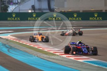 World © Octane Photographic Ltd. Formula 1 –  Abu Dhabi GP - Race. Scuderia Toro Rosso STR13 – Pierre Gasly, McLaren MCL33 – Fernando Alonso and Haas F1 Team VF-18 – Kevin Magnussen. Yas Marina Circuit, Abu Dhabi. Sunday 25th November 2018.