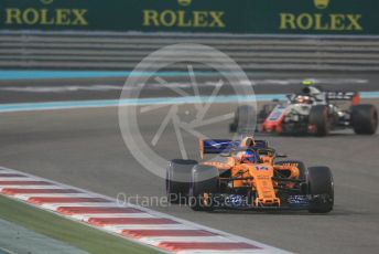 World © Octane Photographic Ltd. Formula 1 –  Abu Dhabi GP - Race. McLaren MCL33 – Fernando Alonso and Haas F1 Team VF-18 – Kevin Magnussen. Yas Marina Circuit, Abu Dhabi. Sunday 25th November 2018.