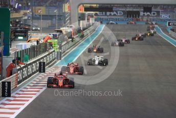 World © Octane Photographic Ltd. Formula 1 –  Abu Dhabi GP - Race. Scuderia Ferrari SF71-H – Sebastian Vettel and Kimi Raikkonen ahead of Alfa Romeo Sauber F1 Team C37 – Charles Leclerc and the rest of the pack. Yas Marina Circuit, Abu Dhabi. Sunday 25th November 2018.