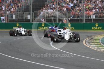 World © Octane Photographic Ltd. Formula 1 – Australian GP - Race. Alfa Romeo Sauber F1 Team C37 – Marcus Ericsson and Charles Leclerc either side of Scuderia Toro Rosso STR13 – Pierre Gasly. Albert Park, Melbourne, Australia. Sunday 25th March 2018.