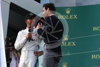 World © Octane Photographic Ltd. Formula 1 – Australian GP - Podium. Mercedes AMG Petronas Motorsport AMG F1 W09 EQ Power+ - Lewis Hamilton with Mark Webber. Albert Park, Melbourne, Australia. Sunday 25th March 2018.