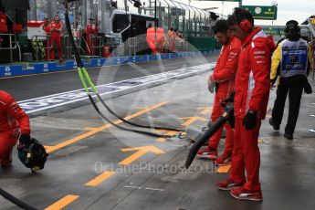World © Octane Photographic Ltd. Formula 1 – Australian GP - Practice 3. Scuderia Ferrari crew drying out their pitbox. Albert Park, Melbourne, Australia. Saturday 24th March 2018.