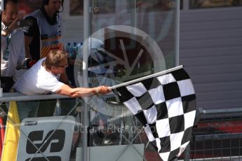 World © Octane Photographic Ltd. Formula 1 – Austrian GP - Race Podium. VIP waving the chequered flag. Red Bull Ring, Spielberg, Austria. Sunday 1st July 2018.