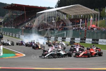 World © Octane Photographic Ltd. Formula 1 – Belgian GP - Race. Mercedes AMG Petronas Motorsport AMG F1 W09 EQ Power+ - Lewis Hamilton and Scuderia Ferrari SF71-H – Sebastian Vettel battle and Renault Sport F1 Team RS18 – Nico Hulkenberg locks up behind. Spa-Francorchamps, Belgium. Sunday 26th August 2018.