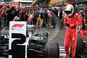 World © Octane Photographic Ltd. Formula 1 – Belgian GP - Race Podium. Scuderia Ferrari SF71-H – Sebastian Vettel looks at the car of Mercedes AMG Petronas Motorsport AMG F1 W09 EQ Power+ - Lewis Hamilton. Spa-Francorchamps, Belgium. Sunday 26th August 2018.