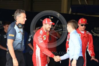 World © Octane Photographic Ltd. Formula 1 – British GP - Qualifying. Scuderia Ferrari SF71-H – Sebastian Vettel and Kimi Raikkonen with Mario Isola – Pirelli Head of Car Racing. Silverstone Circuit, Towcester, UK. Saturday 7th July 2018.