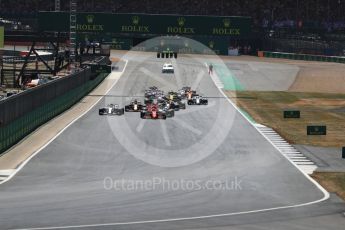 World © Octane Photographic Ltd. Formula 1 – British GP - Race. Race start Vettel's Ferrari leads Hamilton's Mercedes. Silverstone Circuit, Towcester, UK. Sunday 8th July 2018.