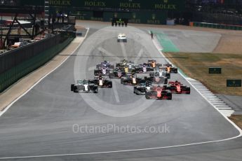 World © Octane Photographic Ltd. Formula 1 – British GP - Race. Race start Vettel's Ferrari leads Hamilton's Mercedes. Silverstone Circuit, Towcester, UK. Sunday 8th July 2018.