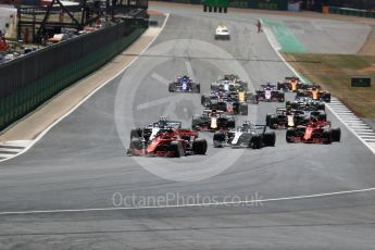 World © Octane Photographic Ltd. Formula 1 – British GP - Race. Scuderia Ferrari SF71-H – Sebastian Vettel with Valtteri Bottas coming up the inside into 2nd. Silverstone Circuit, Towcester, UK. Sunday 8th July 2018.