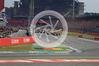World © Octane Photographic Ltd. Formula 1 – German GP - Race. Race start and Scuderia Ferrari SF71-H – Sebastian Vettel holds the lead. Hockenheimring, Baden-Wurttemberg, Germany. Sunday 22nd July 2018.