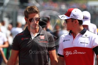 World © Octane Photographic Ltd. Formula 1 – Hungarian GP - Drivers’ Parade. Haas F1 Team VF-18 – Romain Grosjean and Alfa Romeo Sauber F1 Team C37 – Charles Leclerc. Hungaroring, Budapest, Hungary. Sunday 29th July 2018.