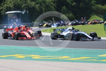World © Octane Photographic Ltd. Formula 1 – Hungarian GP - Race. Scuderia Ferrari SF71-H – Sebastian Vettel while Aston Martin Red Bull Racing TAG Heuer RB14 – Max Verstappen locks a brake behind. Hungaroring, Budapest, Hungary. Sunday 29th July 2018.