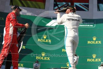 World © Octane Photographic Ltd. Formula 1 – Hungarian GP - Podium. Scuderia Ferrari SF71-H – Sebastian Vettel and Mercedes AMG Petronas Motorsport AMG F1 W09 EQ Power+ - Lewis Hamilton. Hungaroring, Budapest, Hungary. Sunday 29th July 2018.