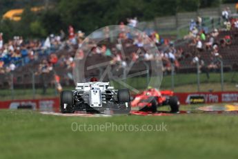 World © Octane Photographic Ltd. Formula 1 – Hungarian GP - Practice 1. Alfa Romeo Sauber F1 Team C37 – Marcus Ericsson and Scuderia Ferrari SF71-H – Kimi Raikkonen. Hungaroring, Budapest, Hungary. Friday 27th July 2018.
