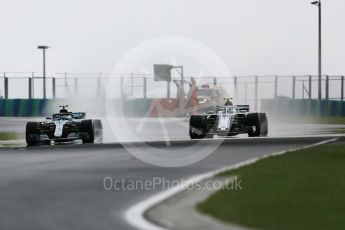 World © Octane Photographic Ltd. Formula 1 – Hungarian GP - Qualifying. Mercedes AMG Petronas Motorsport AMG F1 W09 EQ Power+ - Valtteri Bottas and Alfa Romeo Sauber F1 Team C37 – Charles Leclerc. Hungaroring, Budapest, Hungary. Saturday 28th July 2018.