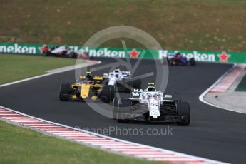 World © Octane Photographic Ltd. Formula 1 – Hungarian GP - Qualifying. Williams Martini Racing FW41 – Sergey Sirotkin and Renault Sport F1 Team RS18 – Carlos Sainz. Hungaroring, Budapest, Hungary. Saturday 28th July 2018.