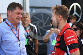 World © Octane Photographic Ltd. Formula 1 – Hungarian GP - Paddock. Scuderia Ferrari – Sebastian Vettel and Thomas Uberall - Red Bull Motorsports Manager. Hungaroring, Budapest, Hungary. Sunday 29th July 2018.