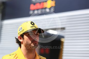 World © Octane Photographic Ltd. Formula 1 – Hungarian GP - Paddock. Renault Sport F1 Team RS18 – Carlos Sainz with Red Bull logo in background. Hungaroring, Budapest, Hungary. Thursday 26th July 2018.