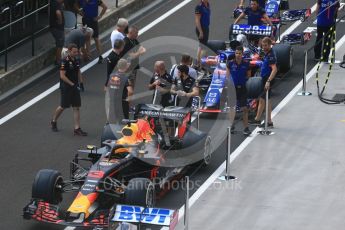 World © Octane Photographic Ltd. Formula 1 – Hungarian GP - Pit Lane. Aston Martin Red Bull Racing TAG Heuer RB14 – Daniel Ricciardo and Scuderia Toro Rosso STR13 – Brendon Hartley. Hungaroring, Budapest, Hungary. Thursday 26th July 2018.