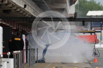 World © Octane Photographic Ltd. Formula 1 – In season test 1, day 2. Haas F1 Team VF-18 garage smoking after engine start. Circuit de Barcelona-Catalunya, Spain. Wednesday 16th May 2018.