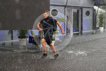 World © Octane Photographic Ltd. Formula 1 – Italian GP - Paddock. Red Bull crew running through the puddles Autodromo Nazionale di Monza, Monza, Italy. Friday 31st August 2018.