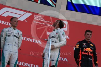 World © Octane Photographic Ltd. Formula 1 – Japanese GP – Podium. Mercedes AMG Petronas Motorsport AMG F1 W09 EQ Power+ - Lewis Hamilton and Valtteri Bottas and Aston Martin Red Bull Racing TAG Heuer RB14 – Max Verstappen. Suzuka Circuit, Japan. Sunday 7th October 2018.