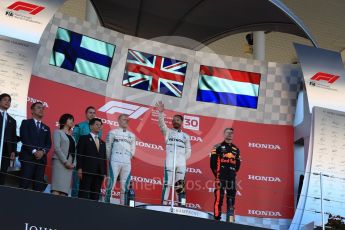 World © Octane Photographic Ltd. Formula 1 – Japanese GP – Podium. Mercedes AMG Petronas Motorsport AMG F1 W09 EQ Power+ - Lewis Hamilton and Valtteri Bottas and Aston Martin Red Bull Racing TAG Heuer RB14 – Max Verstappen. Suzuka Circuit, Japan. Sunday 7th October 2018.