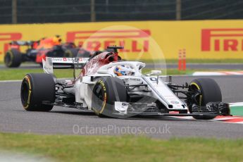 World © Octane Photographic Ltd. Formula 1 – Japanese GP - Practice 1. Alfa Romeo Sauber F1 Team C37 – Marcus Ericsson and Aston Martin Red Bull Racing TAG Heuer RB14 – Daniel Ricciardo. Suzuka Circuit, Japan. Friday 5th October 2018.