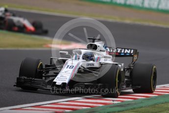 World © Octane Photographic Ltd. Formula 1 – Japanese GP - Practice 2. Williams Martini Racing FW41 – Lance Stroll and Haas F1 Team VF-18 – Kevin Magnussen. Suzuka Circuit, Japan. Friday 5th October 2018.