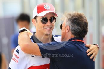 World © Octane Photographic Ltd. Formula 1 – Japanese GP - Paddock. Alfa Romeo Sauber F1 Team C37 – Charles Leclerc and Jean Alesi. Suzuka Circuit, Japan. Sunday 7th October 2018.