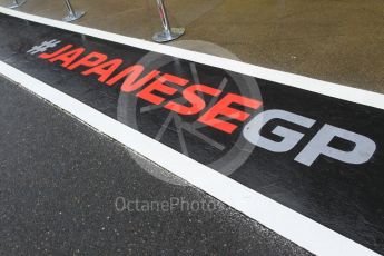 World © Octane Photographic Ltd. Formula 1 – Japanese GP - Pit Lane. Japanese GP pit lane stencilling in the wet . Suzuka Circuit, Japan. Thursday 4th October 2018.