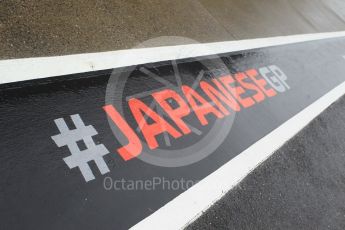 World © Octane Photographic Ltd. Formula 1 – Japanese GP - Pit Lane. Japanese GP pit lane stencilling in the wet . Suzuka Circuit, Japan. Thursday 4th October 2018.