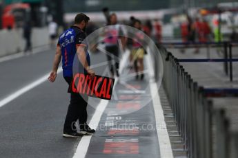 World © Octane Photographic Ltd. Formula 1 – Japanese GP - Pit Lane. Toro Rosso mechanic with "Critical" pit board. Suzuka Circuit, Japan. Thursday 4th October 2018.