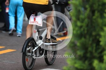 World © Octane Photographic Ltd. Formula 1 – Monaco GP - Paddock. Renault Sport F1 Team RS18 – Nico Hulkenberg on a L plated bike with tiger trainers. Monte-Carlo. Saturday 26th May 2018.