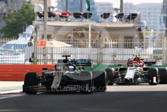 World © Octane Photographic Ltd. Formula 1 – Abu Dhabi GP - Practice 1. Mercedes AMG Petronas Motorsport AMG F1 W10 EQ Power+ - Lewis Hamilton and Alfa Romeo Racing C38 – Antonio Giovinazzi. Yas Marina Circuit, Abu Dhabi, UAE. Friday 29th November 2019.