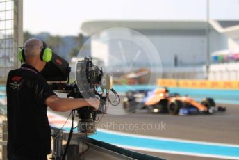World © Octane Photographic Ltd. Formula 1 – Abu Dhabi GP - Practice 3. McLaren MCL34 – Carlos Sainz and trackside TV camera. Yas Marina Circuit, Abu Dhabi, UAE. Saturday 30th November 2019.