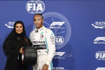 World © Octane Photographic Ltd. Formula 1 – Abu Dhabi GP - Qualifying. Mercedes AMG Petronas Motorsport AMG F1 W10 EQ Power+ - Lewis Hamilton receives the Pirelli Pole Position Award from the Pirelli Representative, FIA Women in Motorsport Commission member and Saudi Arabian racing driver Aseel Al Hamad. Yas Marina Circuit, Abu Dhabi, UAE. Saturday 30th November 2019.