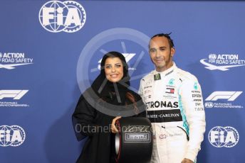 World © Octane Photographic Ltd. Formula 1 – Abu Dhabi GP - Qualifying. Mercedes AMG Petronas Motorsport AMG F1 W10 EQ Power+ - Lewis Hamilton receives the Pirelli Pole Position Award from the Pirelli Representative, FIA Women in Motorsport Commission member and Saudi Arabian racing driver Aseel Al Hamad. Yas Marina Circuit, Abu Dhabi, UAE. Saturday 30th November 2019.
