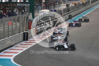 World © Octane Photographic Ltd. Formula 1 – Abu Dhabi GP - Race. Alfa Romeo Racing C38 – Antonio Giovinazzi and Kimi Raikkonen ahead of Mercedes AMG Petronas Motorsport AMG F1 W10 EQ Power+ - Valtteri Bottas. Yas Marina Circuit, Abu Dhabi, UAE. Sunday 1st December 2019.