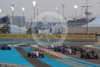 World © Octane Photographic Ltd. Formula 1 – Abu Dhabi GP - Race. SportPesa Racing Point RP19 - Sergio Perez and Scuderia Toro Rosso STR14 – Pierre Gasly (with missing front wing) run wide through turn1. Yas Marina Circuit, Abu Dhabi, UAE. Sunday 1st December 2019.