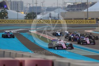 World © Octane Photographic Ltd. Formula 1 – Abu Dhabi GP - Race. SportPesa Racing Point RP19 - Sergio Perez and Scuderia Toro Rosso STR14 – Pierre Gasly (with missing front wing) run wide through turn1. Yas Marina Circuit, Abu Dhabi, UAE. Sunday 1st December 2019.