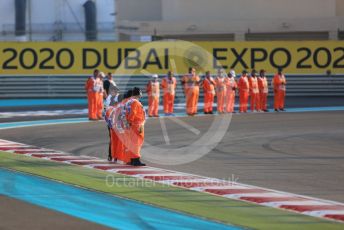 World © Octane Photographic Ltd. Formula 1 - Abu Dhabi GP - Race. Race marshals at turn 1. Yas Marina Circuit, Abu Dhabi, UAE. Sunday 1st December 2019.